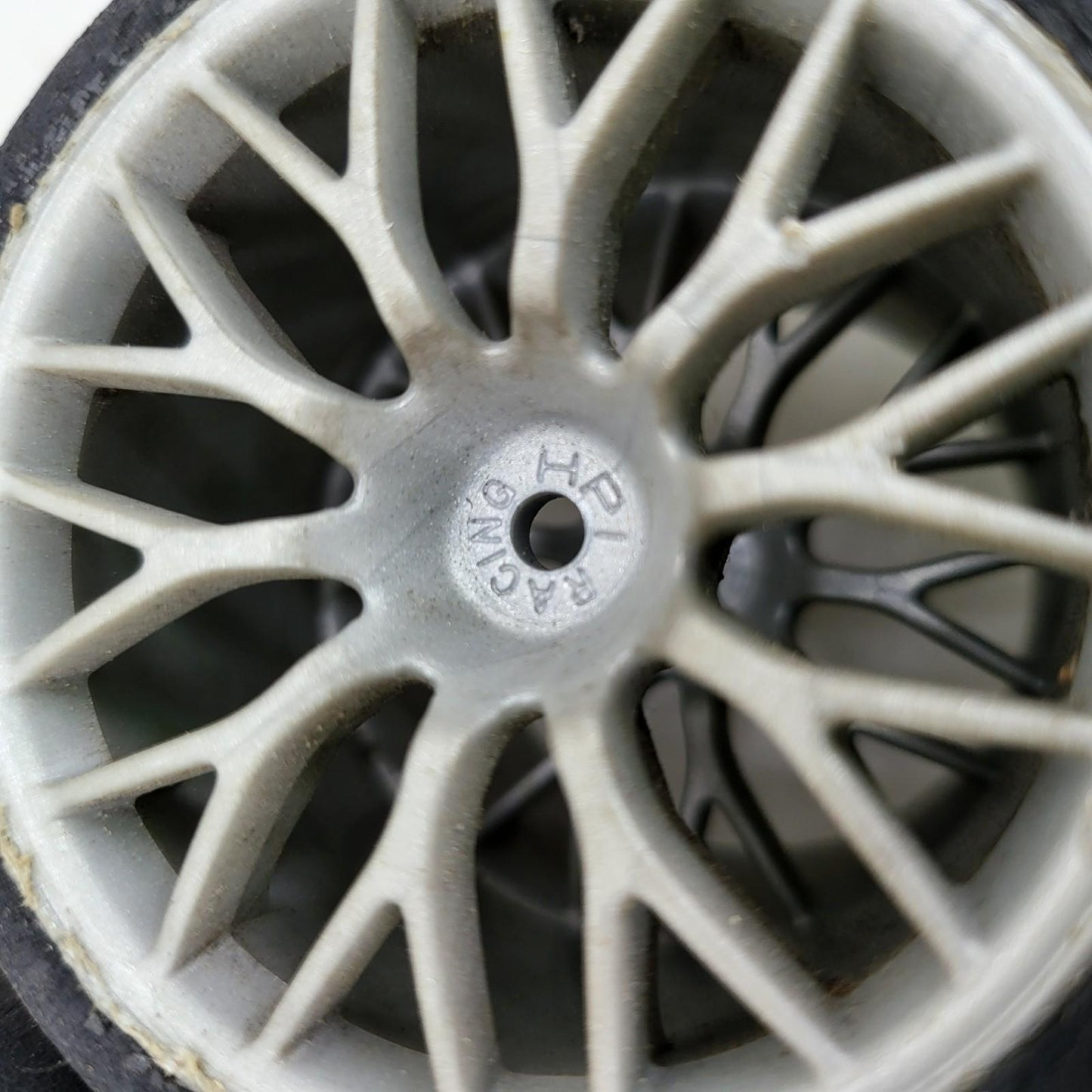 HPI Racing set of 4 1/10th tires with cracking on multi spoke light grey wheels