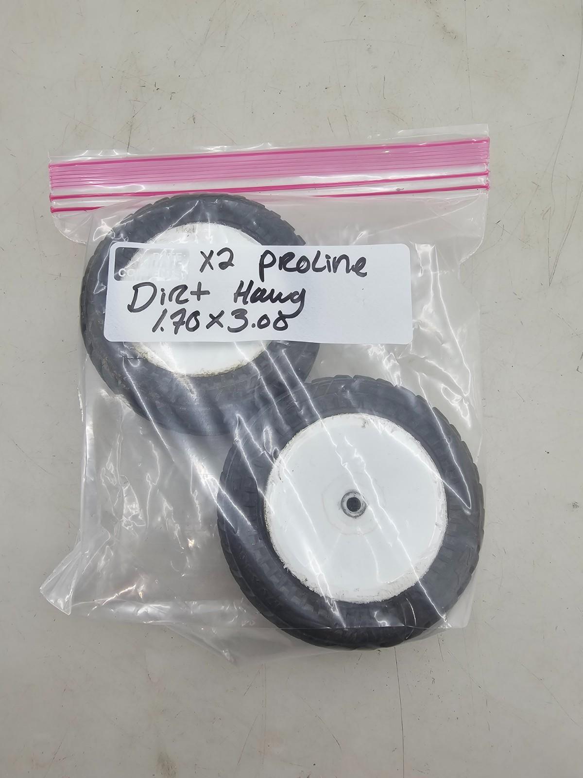 Pro-Line Dirt Hawg tires on white wheels, 1.70 x 3.60 12mm hex