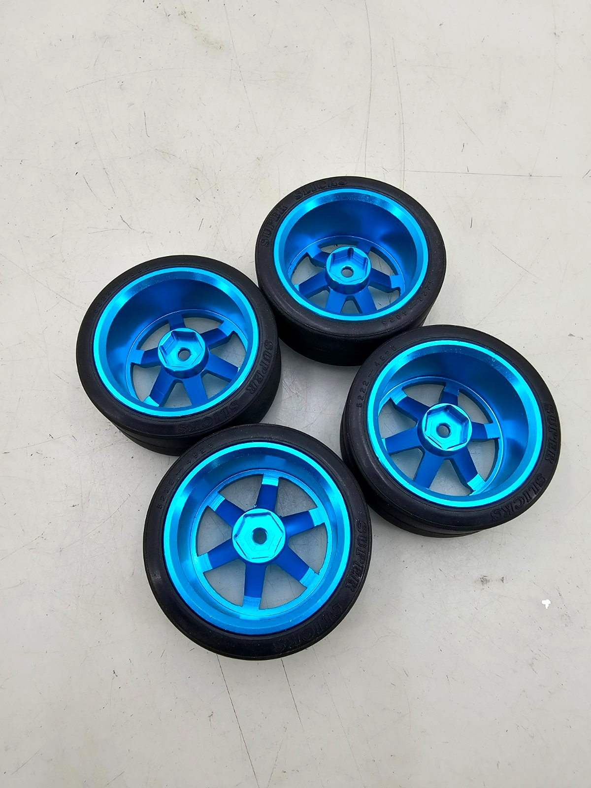 Very nice 1/10th scale blue aluminum 6 spoke TE37 wheels w/ super slicks