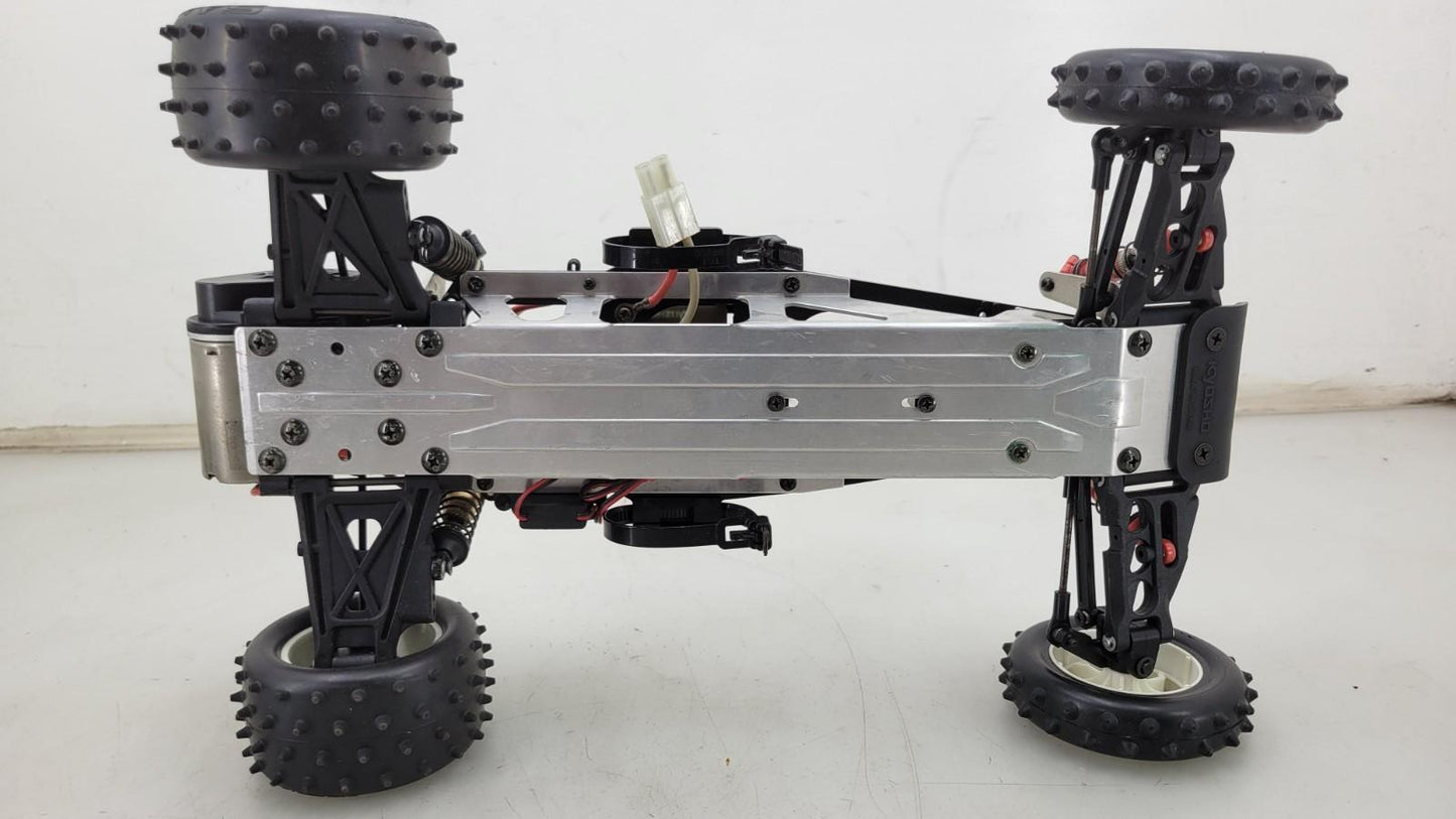 Team Kyosho Ultima 1/10th scale buggy, black and red