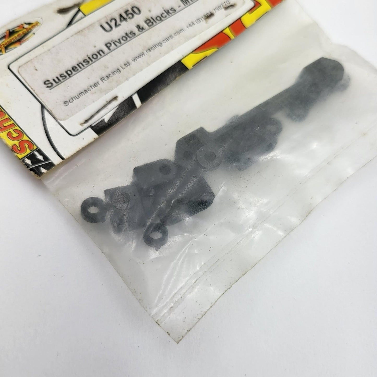 Schumacher suspension pivots & block, Mission Mi1, Mi2, Menace Fusion #U2450
