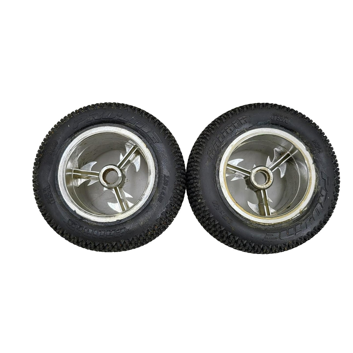 Proline caliber tires on unique old school tri-spoke wheels 1/8th scale