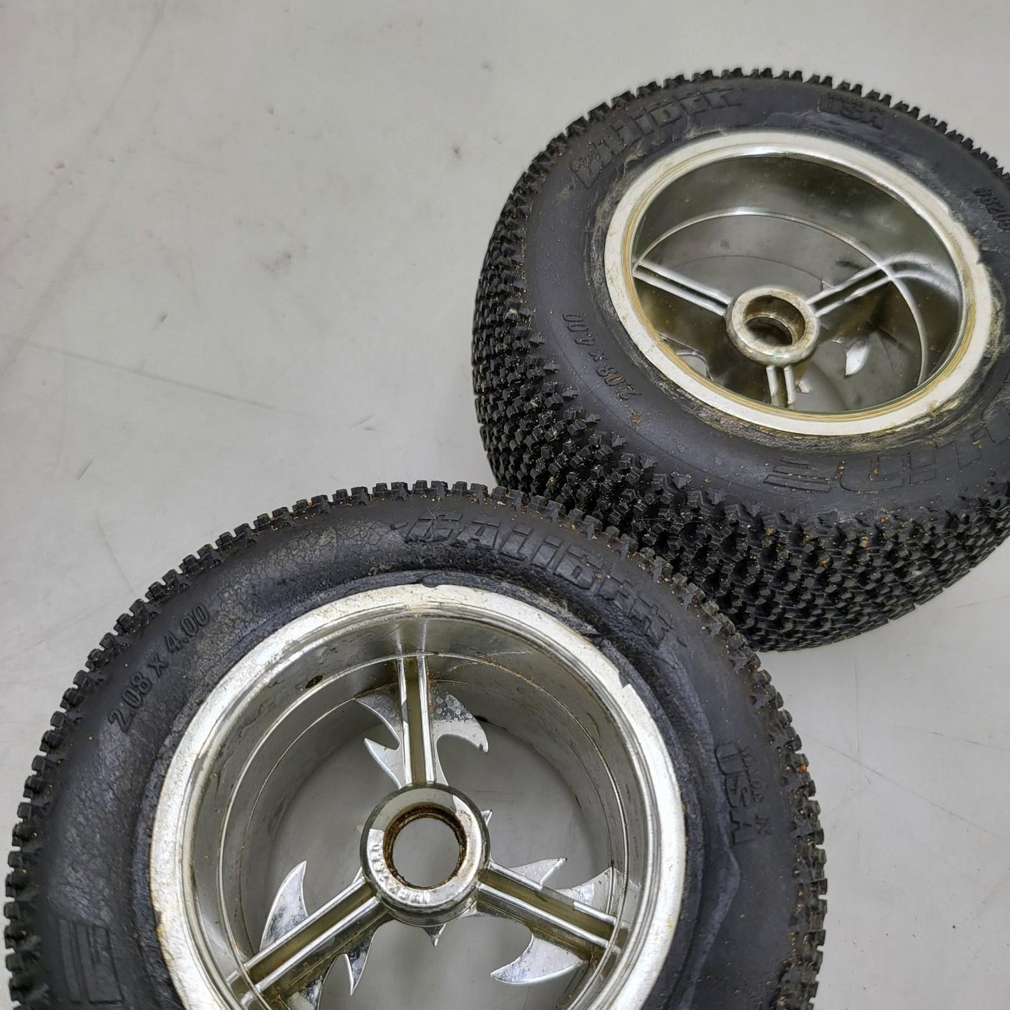 Proline caliber tires on unique old school tri-spoke wheels 1/8th scale