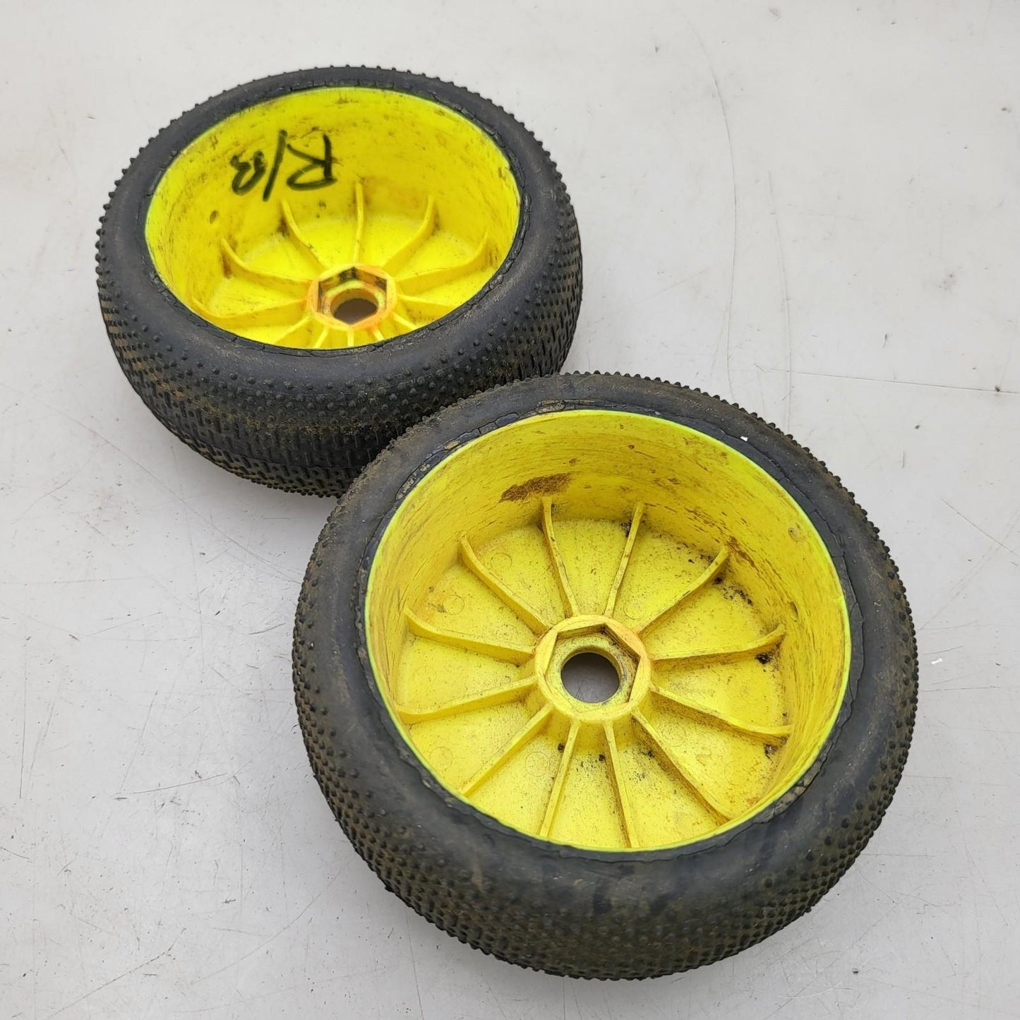 Team Losi yellow buggy wheels  1/8 on taper pin tires, one has flat spot, 17mm