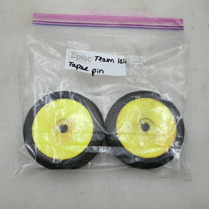 Team Losi yellow buggy wheels  1/8 on taper pin tires, one has flat spot, 17mm
