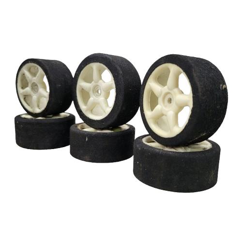 1/10th scale foam tires on cream colored 5 spoke wheels, x6 team associated?