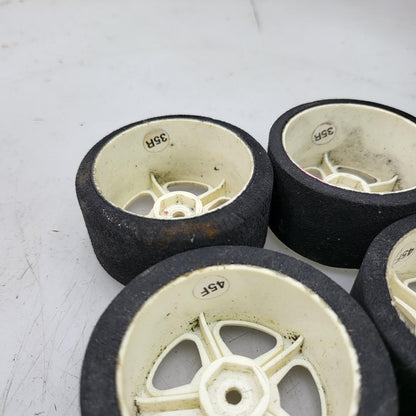 1/10th scale foam tires on cream colored 5 spoke wheels, x6 team associated?