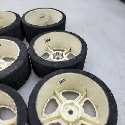 1/10th scale foam tires on cream colored 5 spoke wheels, x6 team associated?