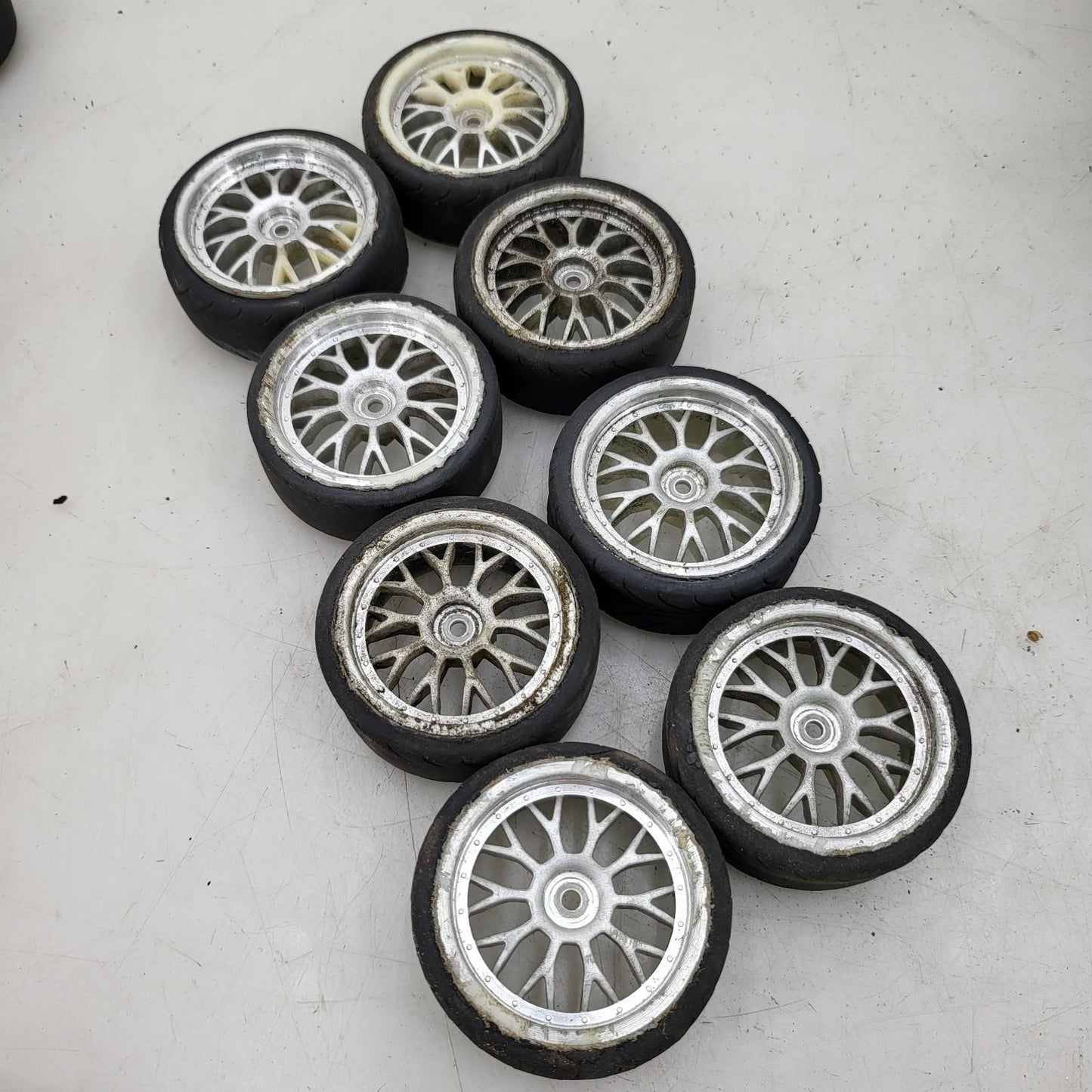1/10th scale street wheels with variously worn tires, x8