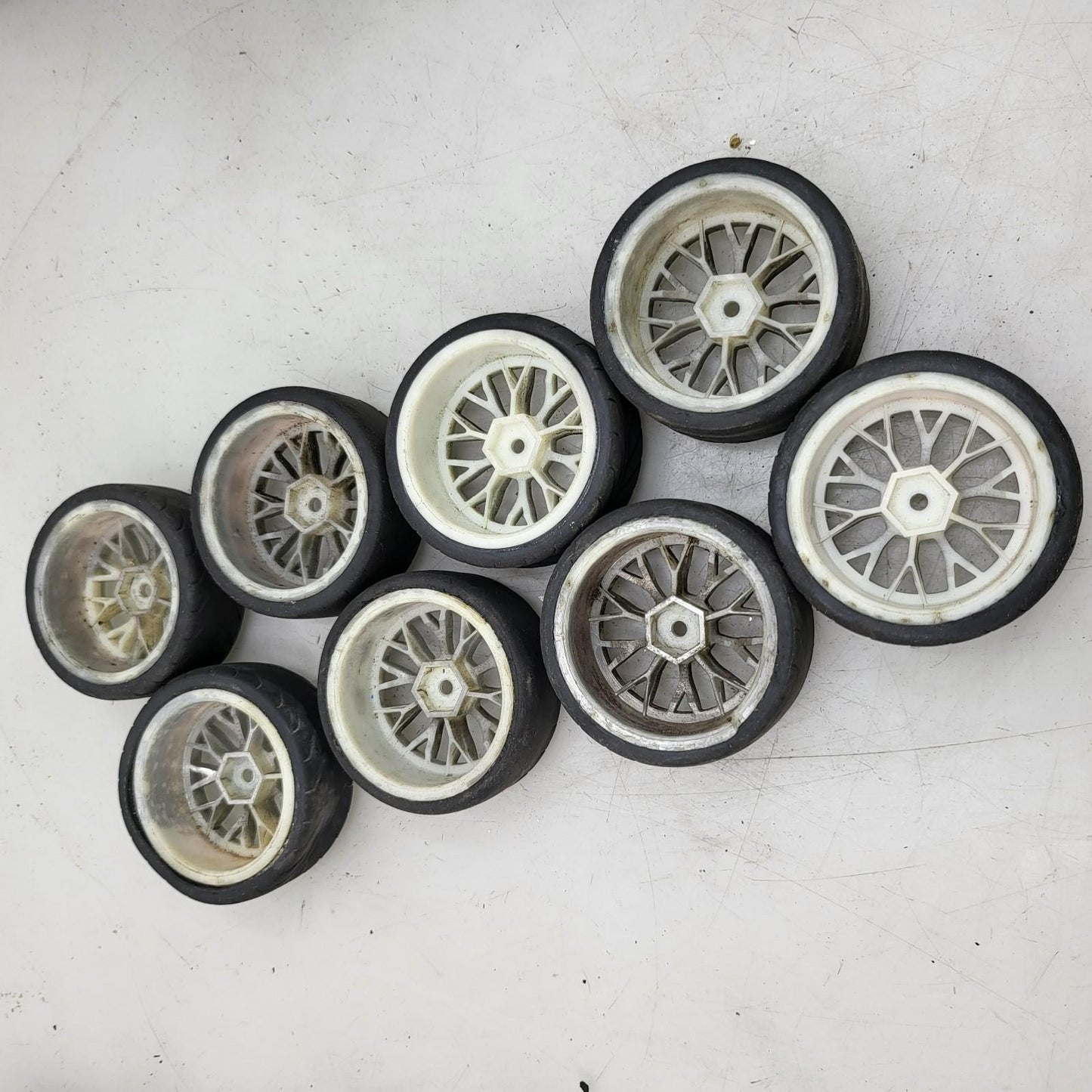1/10th scale street wheels with variously worn tires, x8