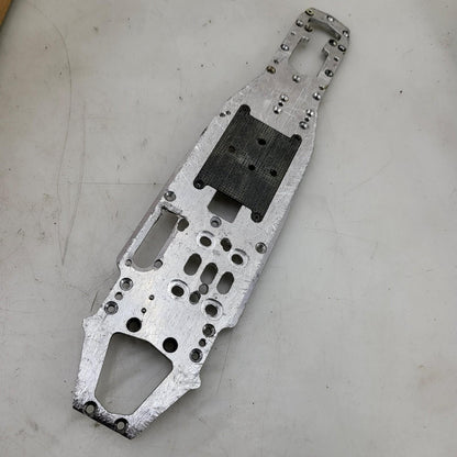 Unknown nitro chassis with extra drilled holes, 15in long. Kyosho, Mugen ?