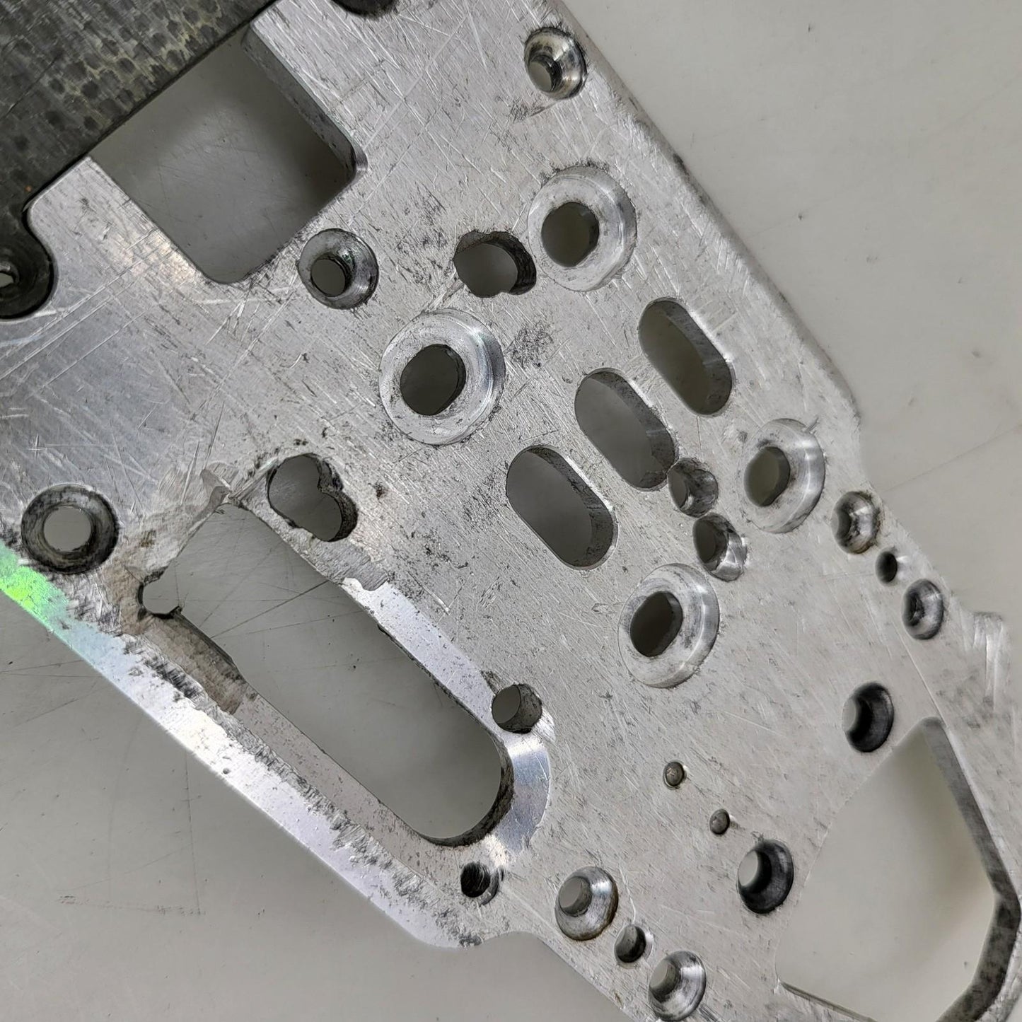 Unknown nitro chassis with extra drilled holes, 15in long. Kyosho, Mugen ?