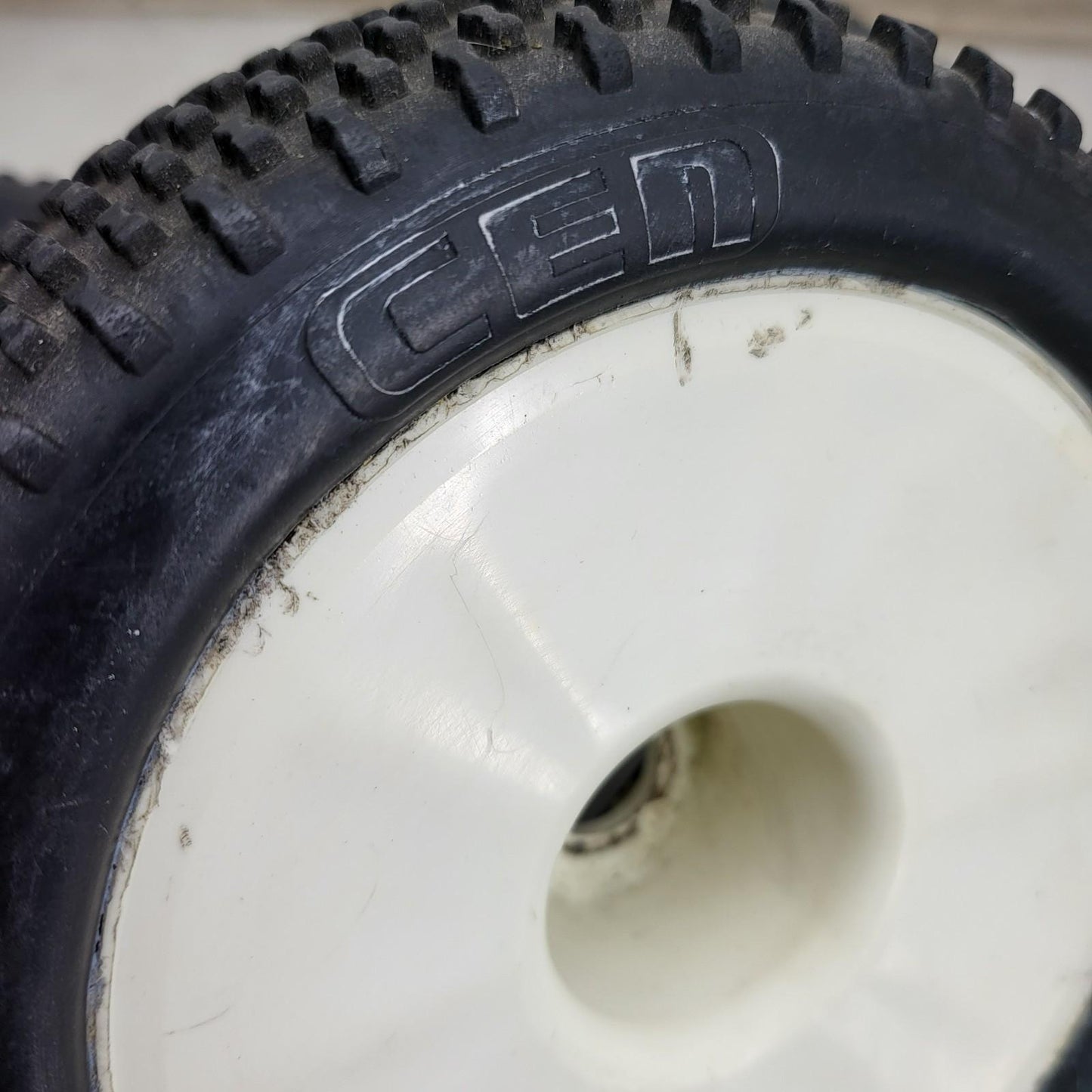 Cen Racing 88-39-122 "Sniper" tires on white buggy wheels  1/8, 1/7 x3