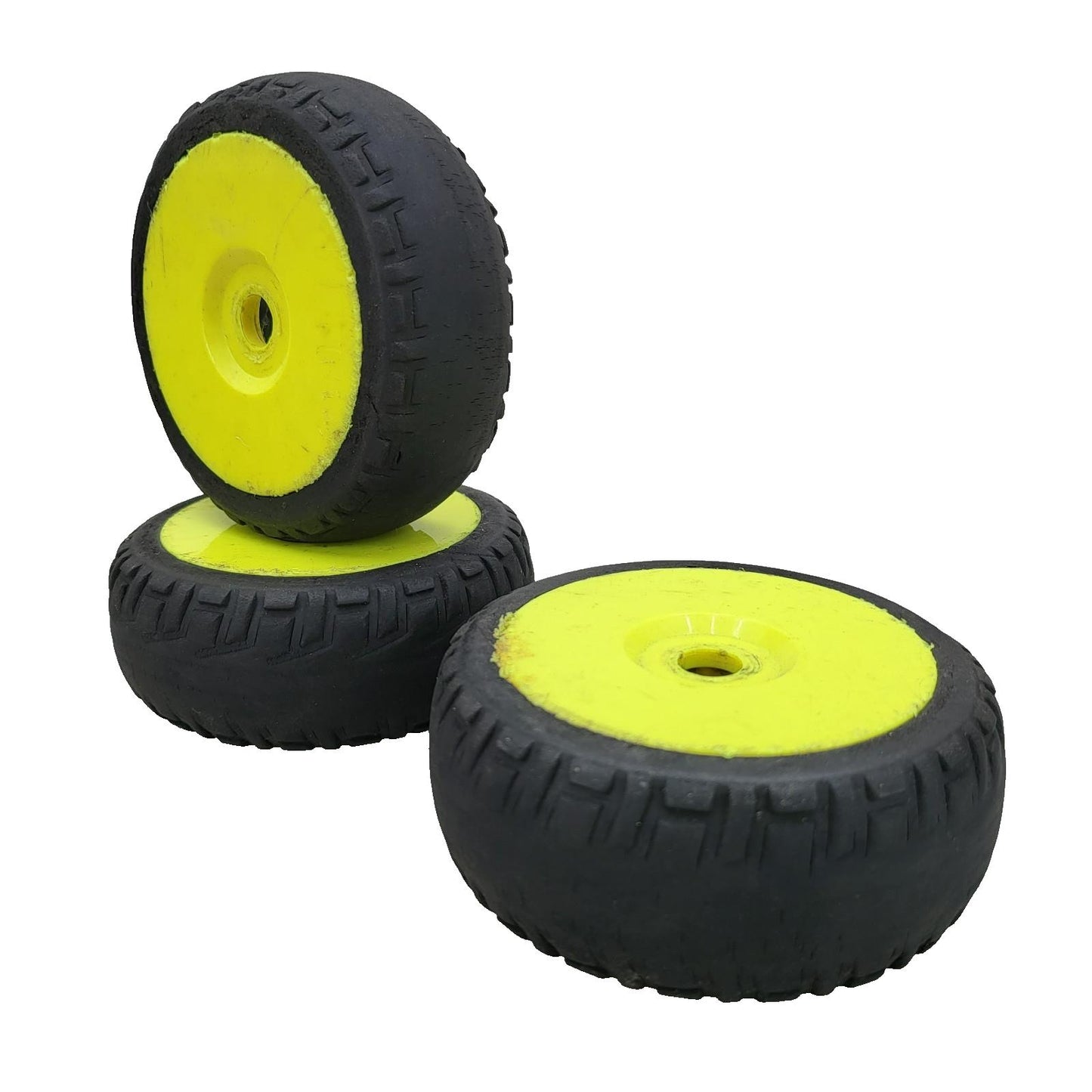 X3 1/10th scale yellow buggy wheels on worn unbranded tires