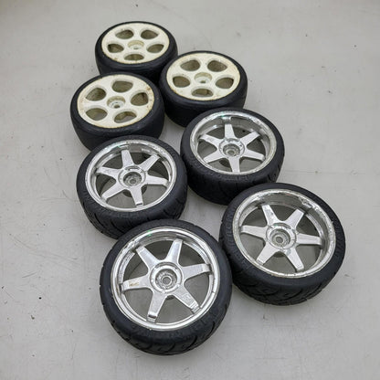 X7 1/10th scale wheels, V-rage tires on 3, HPI on the other 4