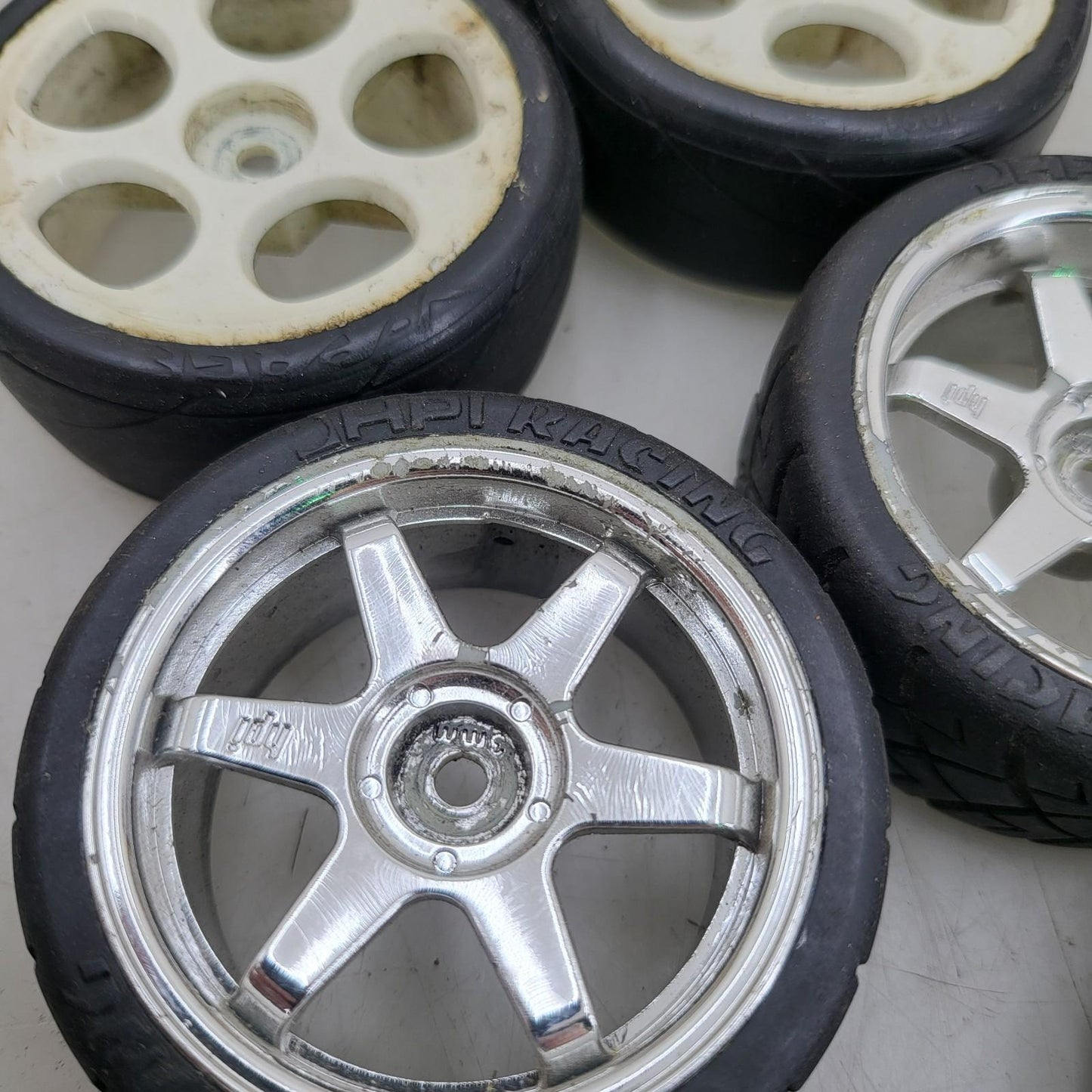 X7 1/10th scale wheels, V-rage tires on 3, HPI on the other 4