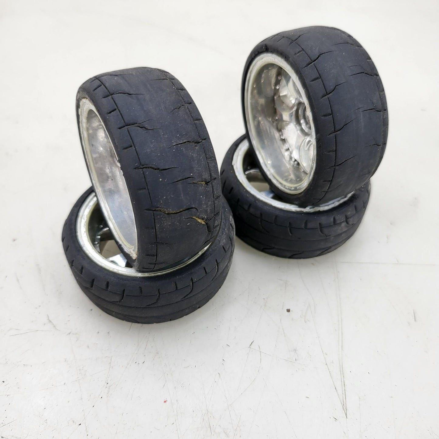 1/10th scale wheels removed from HPI Sprint 2, worn tires