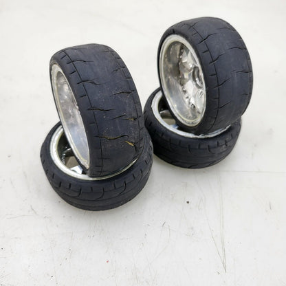 1/10th scale wheels removed from HPI Sprint 2, worn tires