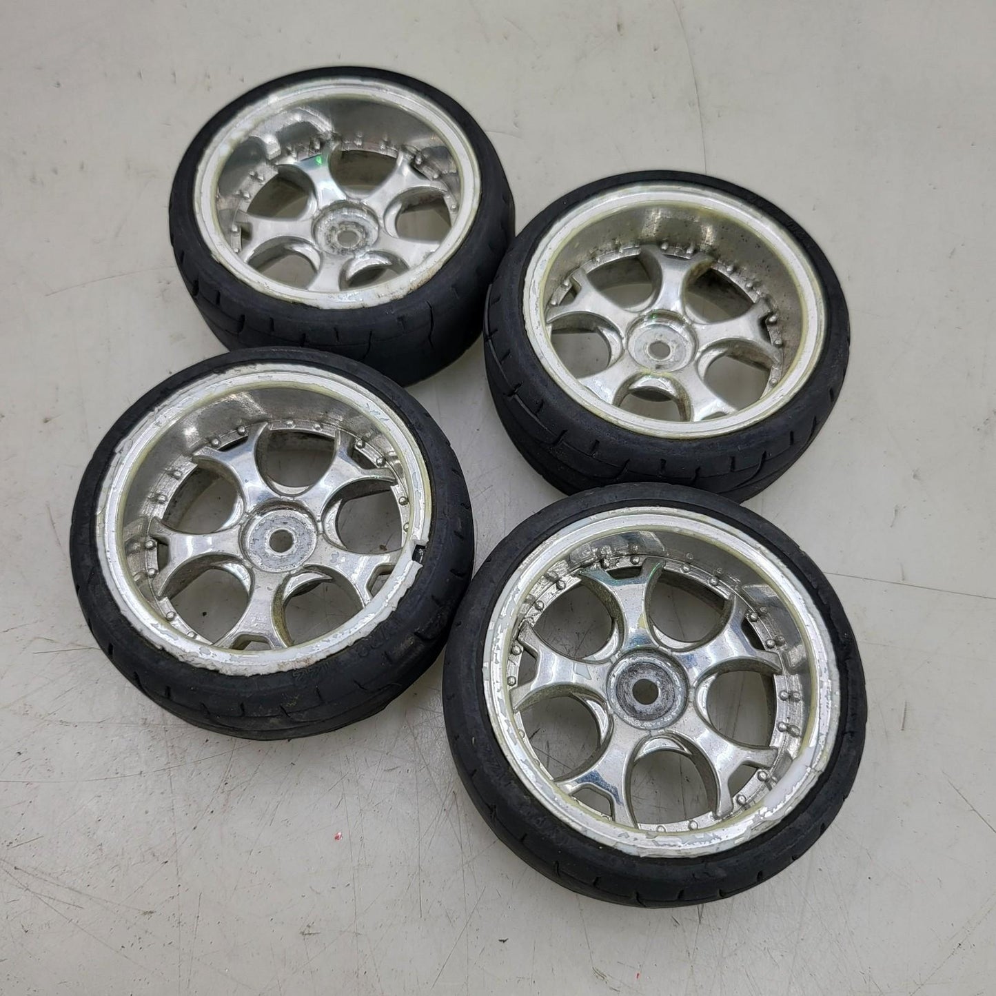 1/10th scale wheels removed from HPI Sprint 2, worn tires