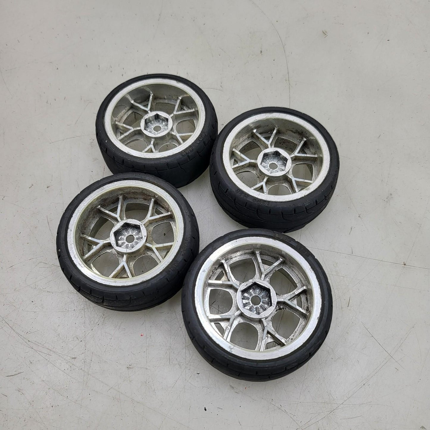 1/10th scale wheels removed from HPI Sprint 2, worn tires