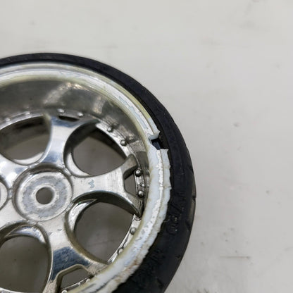 1/10th scale wheels removed from HPI Sprint 2, worn tires