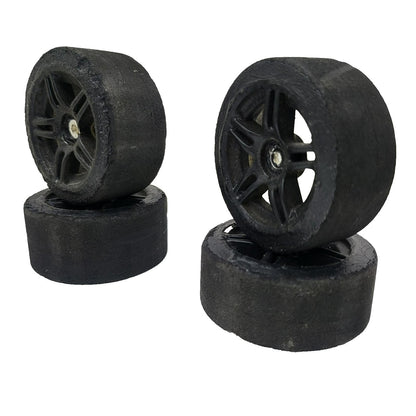 1/10th scale foam tires on black painted multi spokes, removed from TC3
