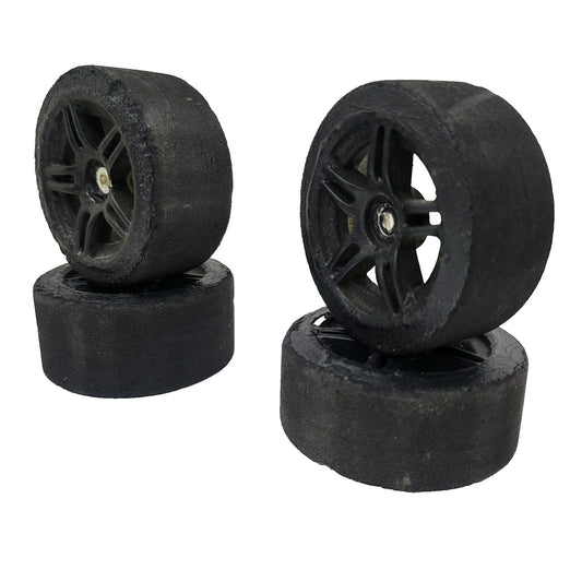 1/10th scale foam tires on black painted multi spokes, removed from TC3