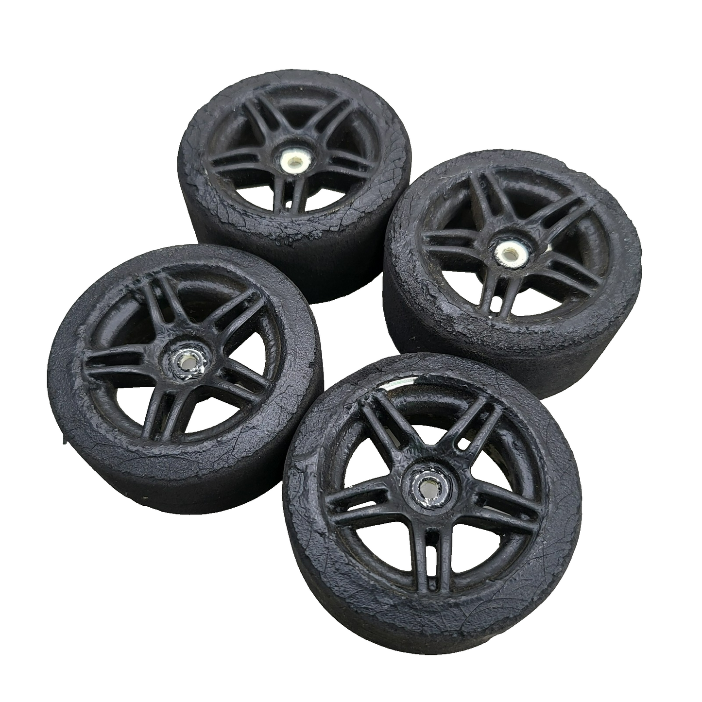 1/10th scale foam tires on black painted multi spokes, removed from TC3