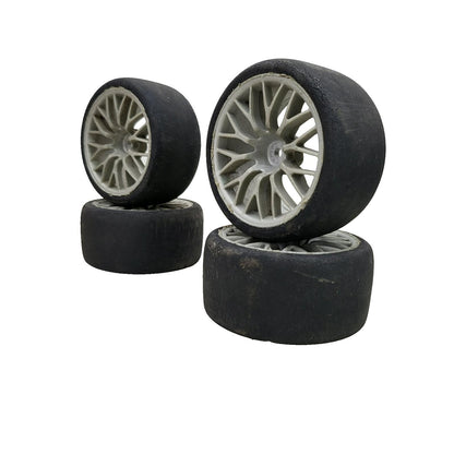 HPI Racing set of 4 1/10th tires with cracking on multi spoke light grey wheels