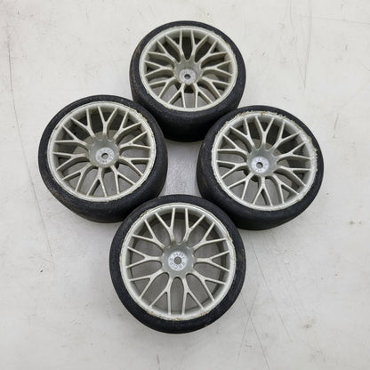 HPI Racing set of 4 1/10th tires with cracking on multi spoke light grey wheels