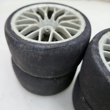 HPI Racing set of 4 1/10th tires with cracking on multi spoke light grey wheels