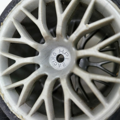 HPI Racing set of 4 1/10th tires with cracking on multi spoke light grey wheels