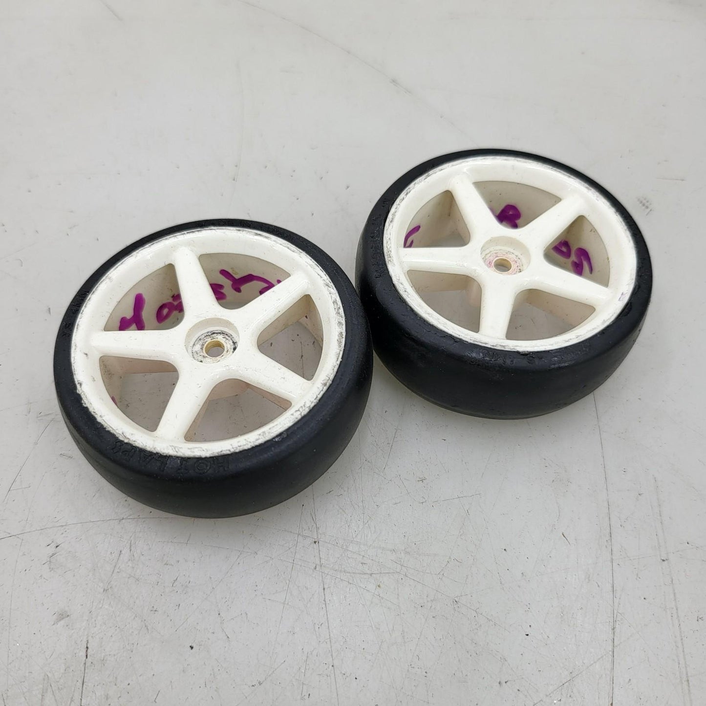 Proline Hot lap 1/10th scale tires on white multi-spoke tires, x2