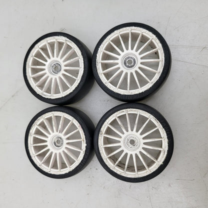 Tamiya 1/10th scale slicks, set of 4. 12mm hex on white multi spoke wheels