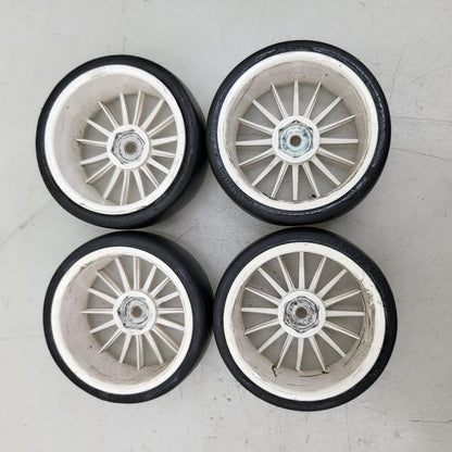 Tamiya 1/10th scale slicks, set of 4. 12mm hex on white multi spoke wheels
