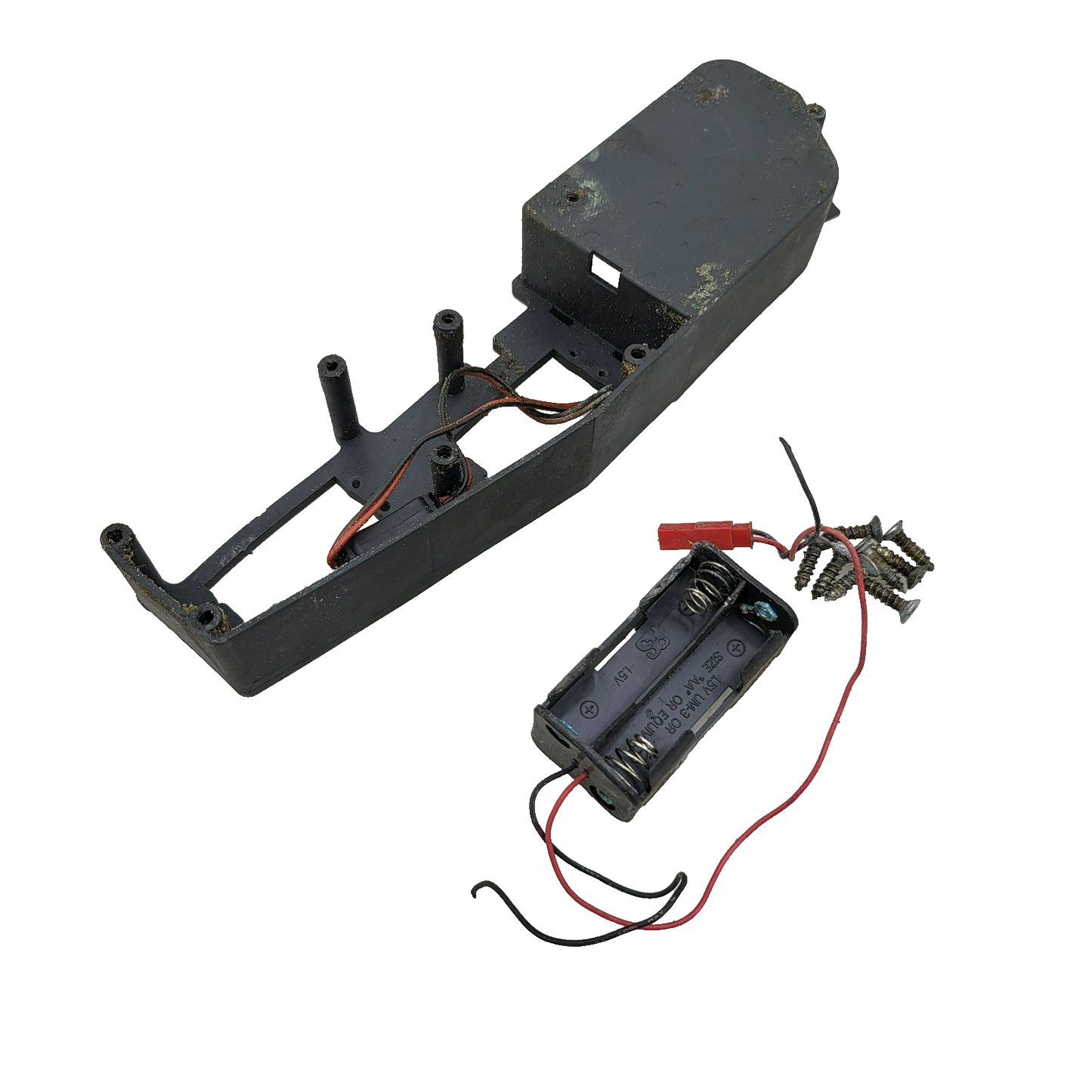 Duratrax Nitro Quake chassis composite deck with battery box, switch, wires cut.