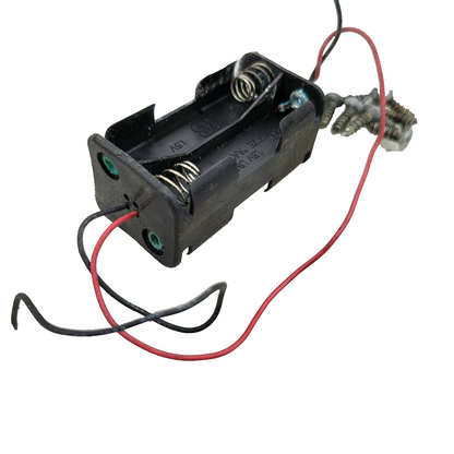 Duratrax Nitro Quake chassis composite deck with battery box, switch, wires cut.
