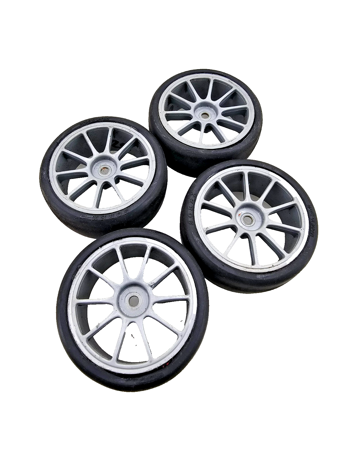 1/10th scale Yokomo Sorex tires on multi spoke light grey wheels, set of four