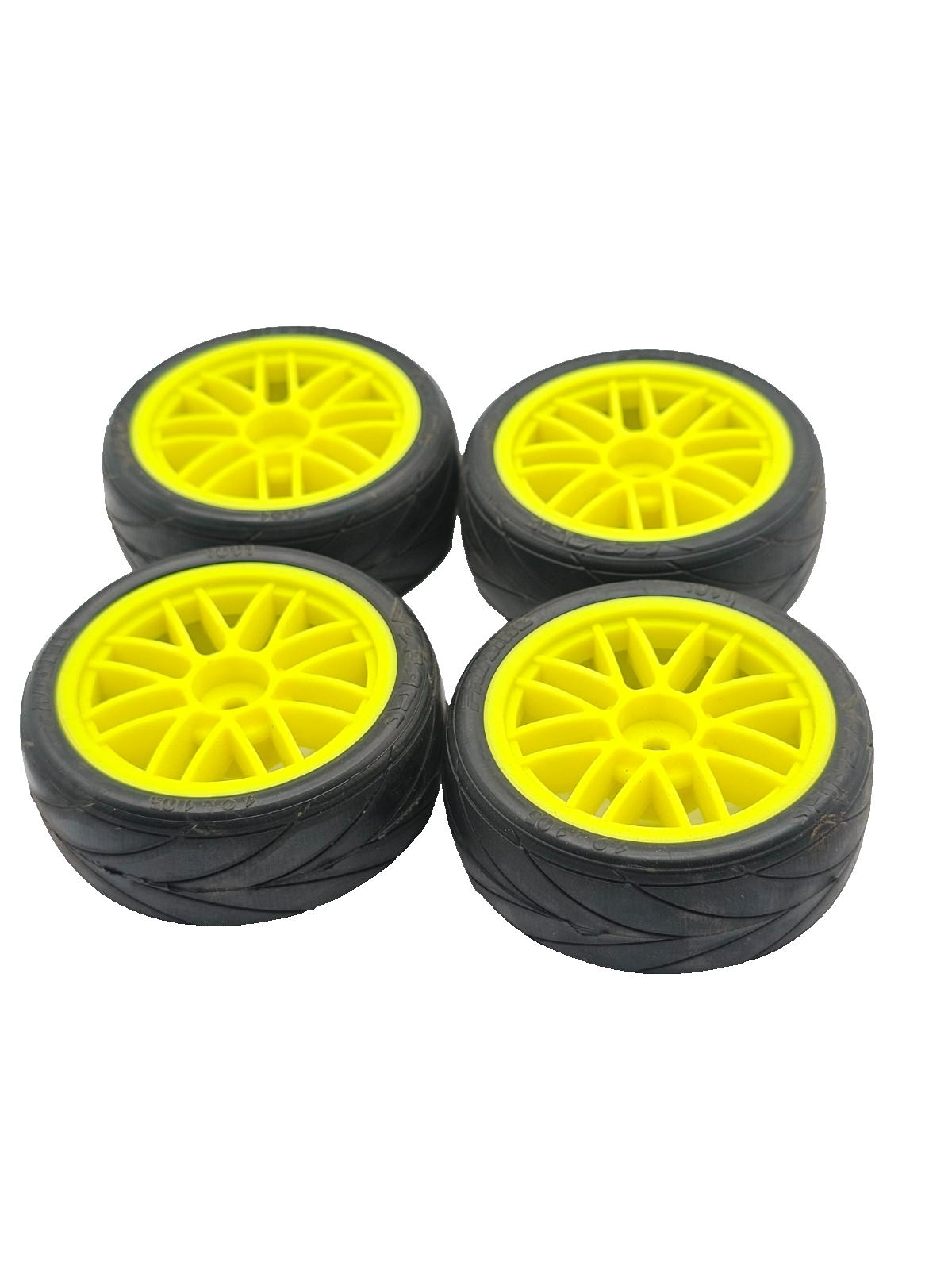 1/10th scale Proline V-rage tires on yellow 12mm hex wheels, multi-spoke not ran
