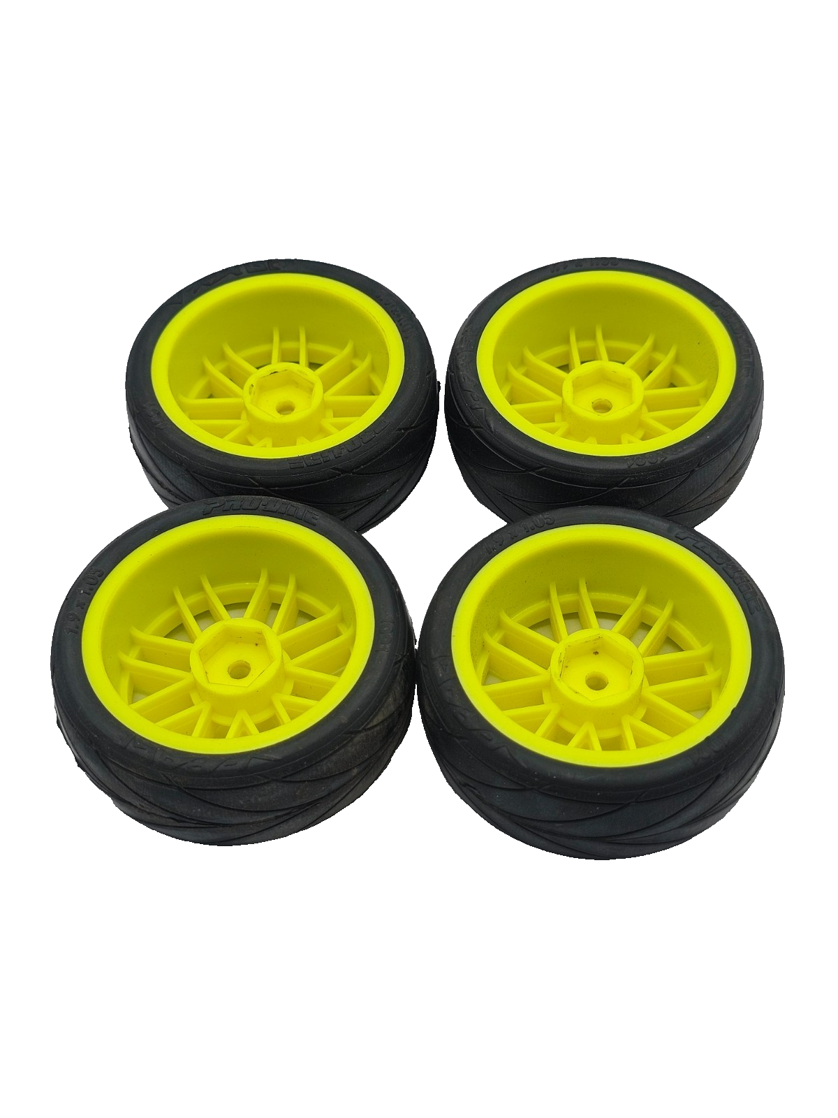 1/10th scale Proline V-rage tires on yellow 12mm hex wheels, multi-spoke not ran