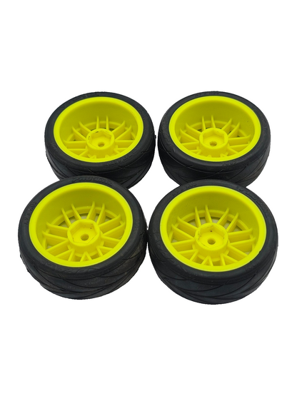 1/10th scale Proline V-rage tires on yellow 12mm hex wheels, multi-spoke not ran