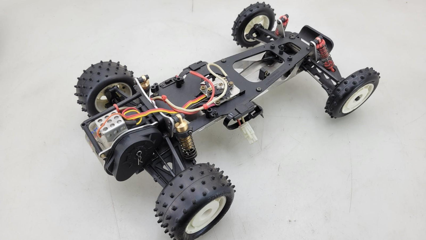 Team Kyosho Ultima 1/10th scale buggy, black and red