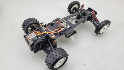 Team Kyosho Ultima 1/10th scale buggy, black and red