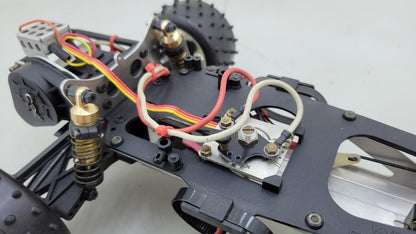 Team Kyosho Ultima 1/10th scale buggy, black and red