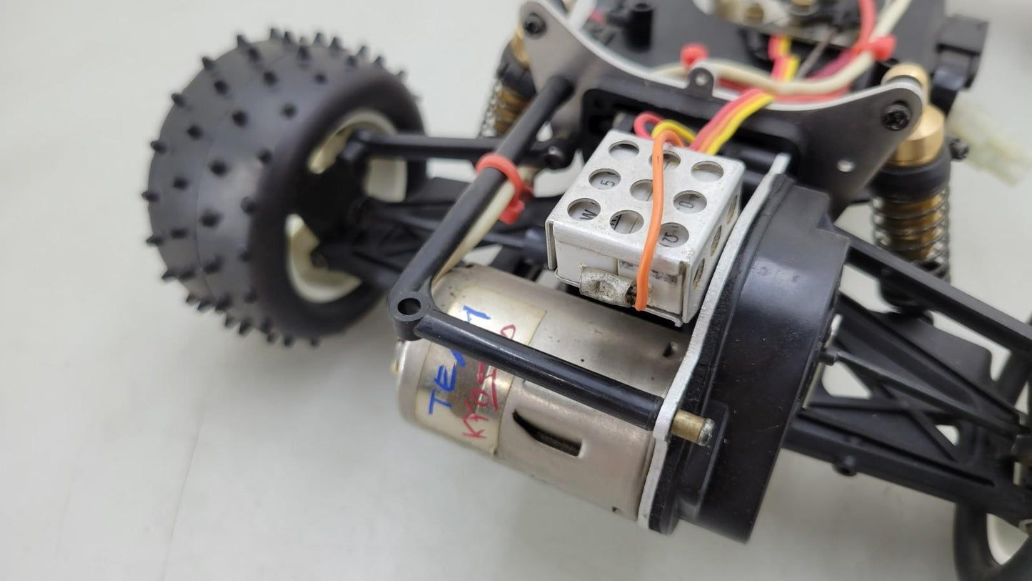 Team Kyosho Ultima 1/10th scale buggy, black and red