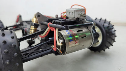 Team Kyosho Ultima 1/10th scale buggy, black and red