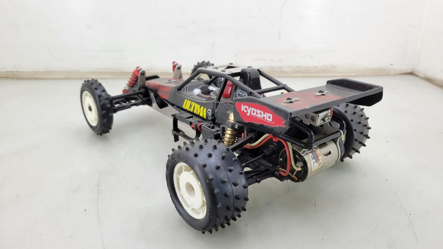 Team Kyosho Ultima 1/10th scale buggy, black and red
