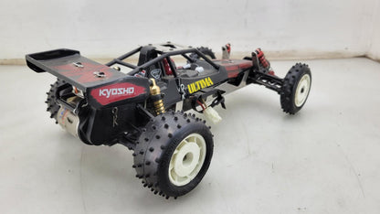 Team Kyosho Ultima 1/10th scale buggy, black and red