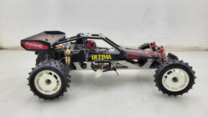Team Kyosho Ultima 1/10th scale buggy, black and red