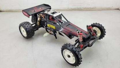 Team Kyosho Ultima 1/10th scale buggy, black and red